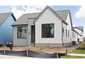 Beautiful exterior showcasing modern architecture with a mix of gray and white siding, offering a fresh and inviting appeal at 17354 Newton Main St, Westfield, IN 46074