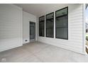 Covered patio featuring sleek doors, creating a perfect space for outdoor relaxation and entertainment at 17354 Newton Main St, Westfield, IN 46074