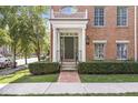 Classic townhouse entrance with brick walkway, and neat landscaping at 2183 Glebe St, Carmel, IN 46032