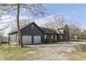 Exterior view of the home with an attached garage, set on a spacious lot at 3357 Saddle Club Rd, Greenwood, IN 46143