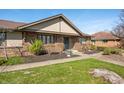 Well-maintained brick home with lush lawn and mature trees in a residential neighborhood at 3875 Offshore Dr, Columbus, IN 47203