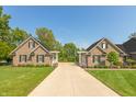 Long driveway leads to two houses, divided by white pergola at 6017 Quail Creek Blvd, Indianapolis, IN 46237