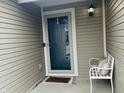 Welcoming front porch area with a cute bench and stylish decorations at 6331 Enclave Blvd, Greenwood, IN 46143