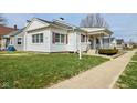 Quaint single-story home with red shutters and a well-maintained lawn at 858 E Berwyn St, Indianapolis, IN 46203