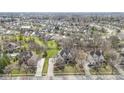 Expansive aerial view showcasing the neighborhood with lush greenery and well-spaced homes at 9931 Woodlands Dr, Fishers, IN 46037