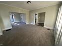 Open living space with new carpeting, neutral tones, and natural light at 1124 Victory Ct, Anderson, IN 46016