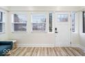 Bright entryway featuring modern flooring, ample natural light, and neutral paint at 1331 N Grant Ave, Indianapolis, IN 46201