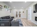 Spacious living room featuring a modern fireplace, plush seating, and ample natural light at 1331 N Grant Ave, Indianapolis, IN 46201