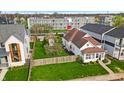 Aerial view of the home and its surrounding landscape and fence at 1655 Cornell Ave, Indianapolis, IN 46202