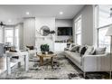 Bright living room with a fireplace, modern furnishings, and natural light, perfect for comfortable living at 1665 N College Ave, Indianapolis, IN 46202