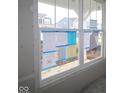 Large window with view of new construction, providing natural light to future living space at 16829 Silo Meadows Dr, Noblesville, IN 46060