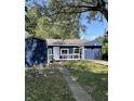 Charming home featuring blue siding, white trim, and a well-manicured front lawn at 2813 Collier St, Indianapolis, IN 46241