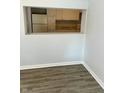 An open window shows the kitchen that has white cabinets and neutral countertops at 2813 Collier St, Indianapolis, IN 46241