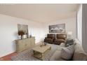 Staged living room with neutral tones, featuring stylish furniture and decor at 3398 S 600 W, New Palestine, IN 46163