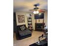 Cozy living room with a fireplace, ceiling fan, and comfortable seating arrangement at 4291 Village Parkway W Cir # 8, Indianapolis, IN 46254