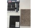 Selection of interior materials, including carpet, cabinet, brick, and countertops at 4739 E Shadowbrook Dr, Camby, IN 46113