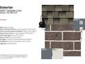 Exterior brick detail with timberline weathered blend shingles and seaside black lighting at 6887 Oakdale Ln, Avon, IN 46123