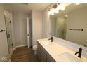 Stylish bathroom featuring double sink vanity and sleek modern fixtures at 7081 Pate Hollow Dr, Brownsburg, IN 46112