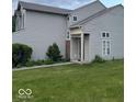 A charming two-story home with neutral siding and a well-manicured lawn at 8033 Lake Tree Cir, Indianapolis, IN 46217