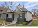 Beautiful home showcasing a covered front porch, fresh landscaping, and inviting curb appeal at 843 N Oxford St, Indianapolis, IN 46201