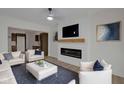 Bright and modern living room featuring a sleek fireplace and an open-concept design at 843 N Oxford St, Indianapolis, IN 46201