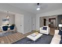 Bright living room with new wood floors, open to a dining area and modern kitchen at 843 N Oxford St, Indianapolis, IN 46201