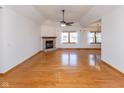 Spacious living room with hardwood floors, brick fireplace, and ample natural light at 1114 Woodridge, Brownsburg, IN 46112