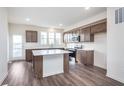 Bright, modern kitchen with stainless steel appliances, center island, and sleek countertops at 14562 Hanford Ln, Carmel, IN 46074