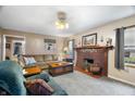 Cozy living room with brick fireplace, comfortable seating and neutral decor at 15 N Fleming St, Indianapolis, IN 46222