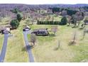 Spacious property with a well-maintained home, long driveway, and lush green lawn at 195 Hess Rd, Martinsville, IN 46151