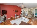 Cozy living room with a ceiling fan, comfortable seating, and stylish decor at 198 Rapid Rill Ln, Brownsburg, IN 46112