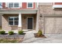 Close up of front door and garage; brick and siding combination at 2324 Boneset Dr, Plainfield, IN 46168