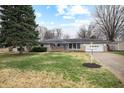 Charming ranch-style home with a well-maintained lawn and a cozy, inviting exterior at 3013 E 7Th St, Anderson, IN 46012