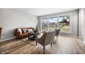 Bright living room featuring hardwood floors, a large window, and modern furnishings at 3013 E 7Th St, Anderson, IN 46012