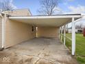 Spacious covered carport offering ample parking and protection from the elements at 329 Roosevelt Dr, Shelbyville, IN 46176
