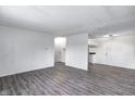 Open-concept living area with durable flooring, leading to a kitchen at 6 Helena Ct, Indianapolis, IN 46222