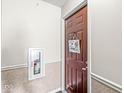 Inviting entryway featuring a decorative welcome sign and fire extinguisher for peace of mind at 6231 Amber Creek Ln # 312, Indianapolis, IN 46237