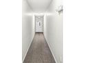Clean, well-lit hallway with neutral colors and durable carpeting, creating a welcoming path at 6231 Amber Creek Ln, Indianapolis, IN 46237