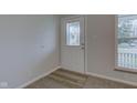 Bright foyer featuring a decorative glass door and nice flooring at 6503 W 15Th St, Indianapolis, IN 46214