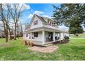 Inviting home with a spacious covered porch, swing, red shutters, and well-kept lawn, blending comfort with classic charm at 6611 Valley Mills Ave, Indianapolis, IN 46241
