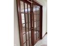 Elegant office featuring glass-paneled doors with dark wood trim and stylish brass hardware at 6816 Russett Dr, Plainfield, IN 46168