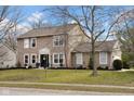 Attractive home with a well-manicured lawn, tasteful landscaping, and a welcoming front entrance at 7383 Poppyseed Dr, Indianapolis, IN 46237