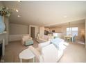 Open-concept living area featuring neutral tones, with access to a bright kitchen and a dining area at 7713 Imperial Eagle Dr, Zionsville, IN 46077