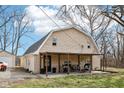 Charming brick home featuring a covered patio, perfect for outdoor relaxation and entertaining guests at 7845 Bluff Rd, Indianapolis, IN 46217
