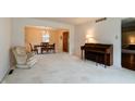 Spacious living room featuring plush carpeting, neutral walls, and seamless transition into the dining area at 8151 Taunton Rd, Indianapolis, IN 46260