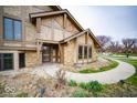 Inviting entrance with stucco and stone with a walkway leading to the front door at 960 Carmen Ct, Greenwood, IN 46143