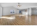 Spacious and open living area featuring beautiful hardwood floors and abundant natural light at 13381 N White Cloud Ct, Camby, IN 46113