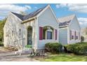 Well-maintained home with charming architectural details and neat landscaping at 1617 S N St, Elwood, IN 46036