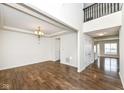 Bright living room featuring hardwood floors, natural light, and modern fixtures at 18203 Sunbrook Way, Westfield, IN 46074