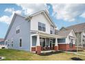 Beautiful two-story home with a welcoming porch, offering curb appeal at 2156 W 171St St, Westfield, IN 46074